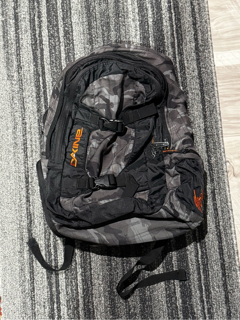 Dakine Gray Camo Backpack with Black and Orange Accents